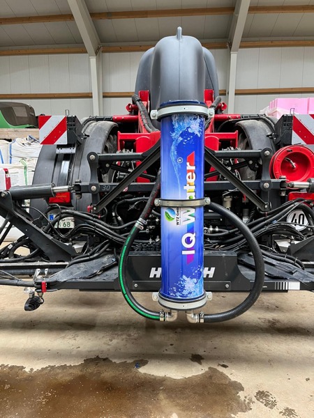 IQ Water unit mounted on agricultural sprayer with yellow tank